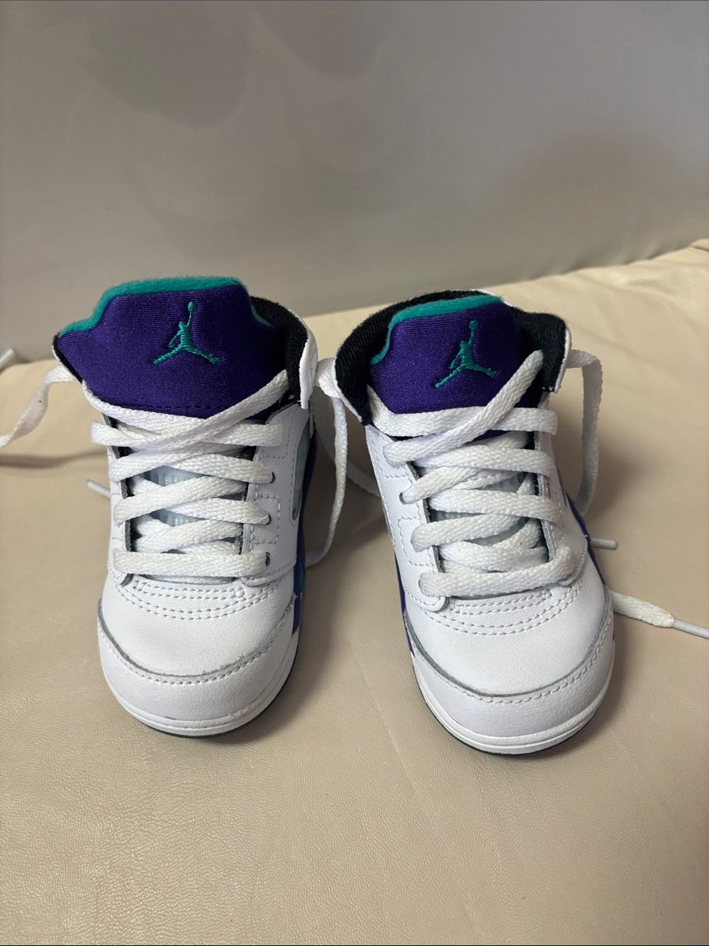 Jordan Kids White Sneakers with Purple and Teal Accents